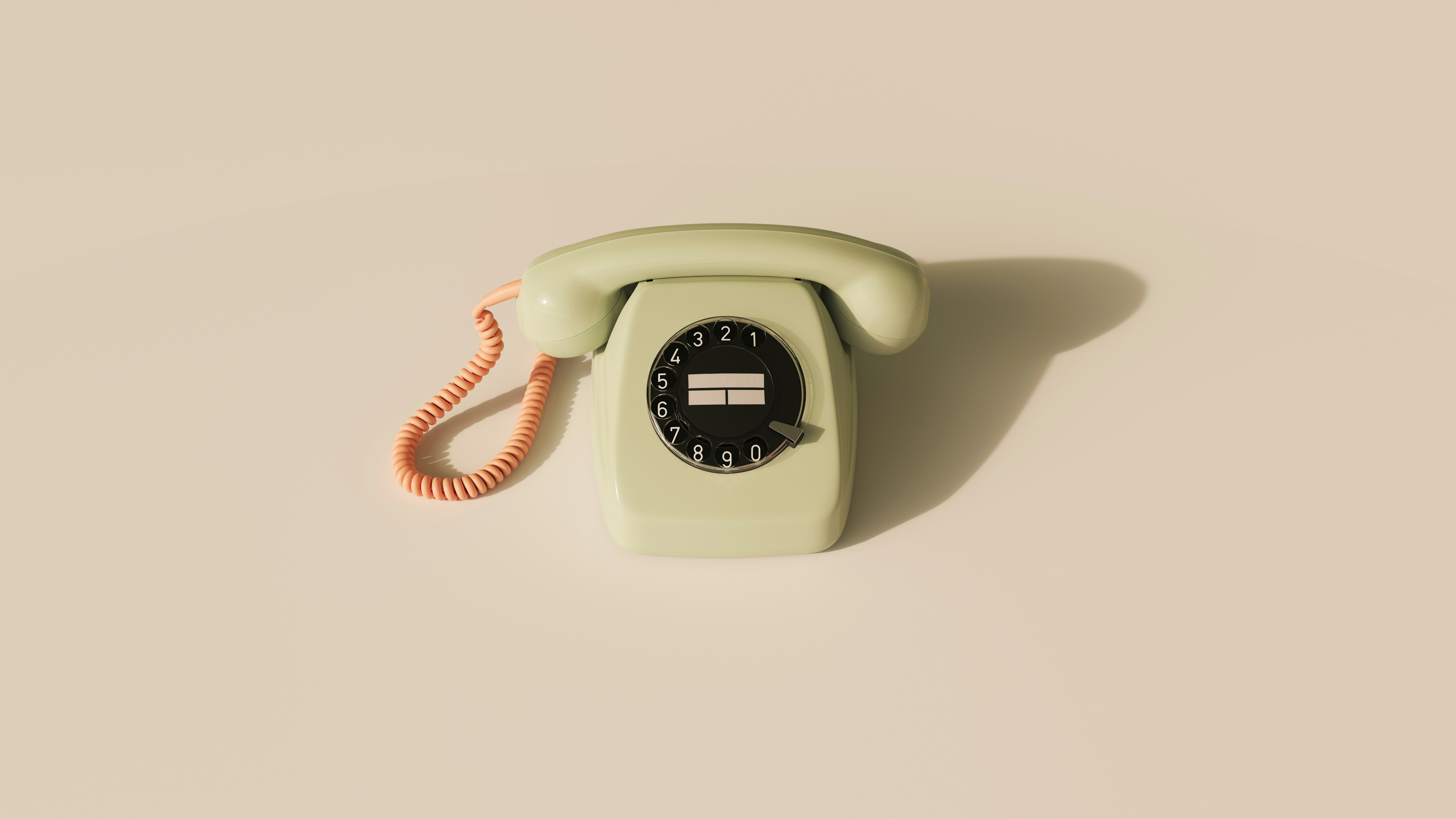 an old fasioned light green telephone with an orange cord